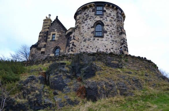 part of a castle over a hill with sky background