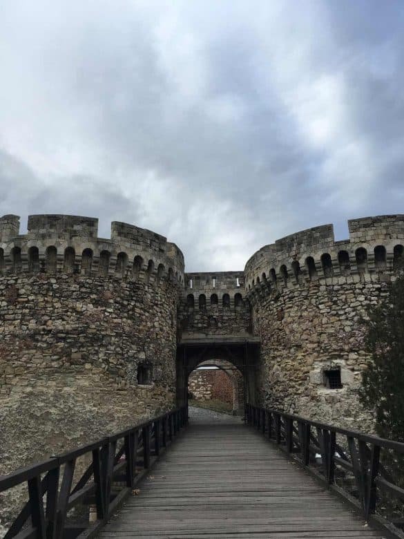 bridge leading to old fortress with one tower on each side