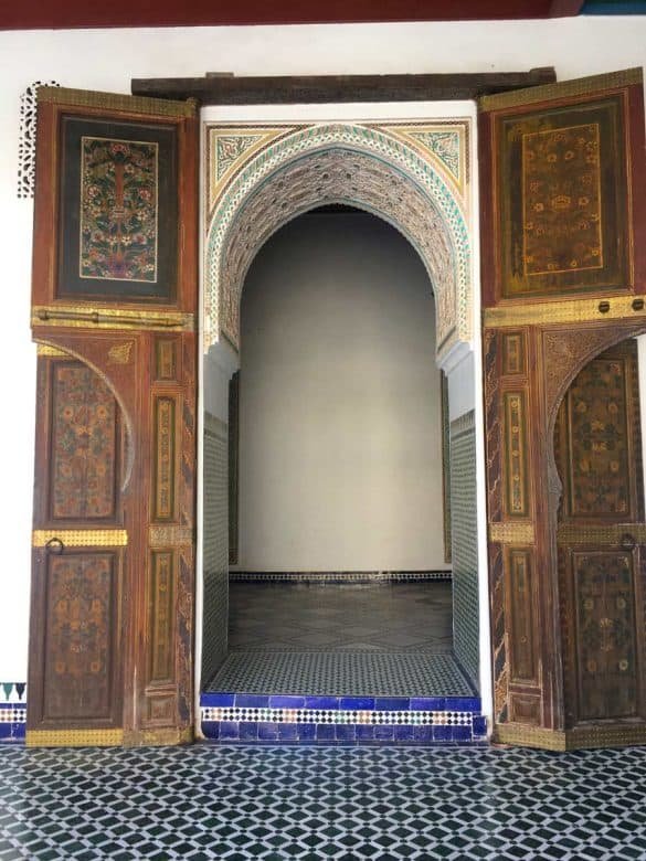 Bahia Palace – Marrakesh an open door of brown colour inside a Moroccan palace