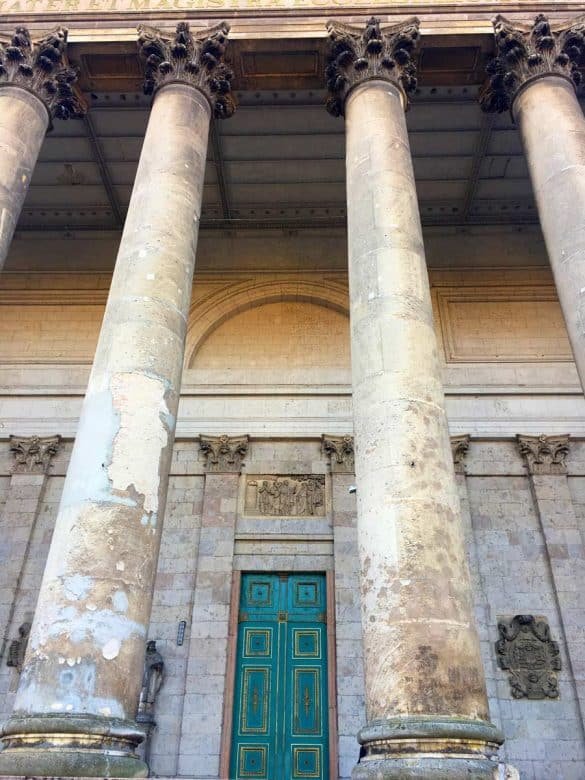 Basilica of Esztergom – Budapest the turquoise door of esztergom basilica amidst stone columns
