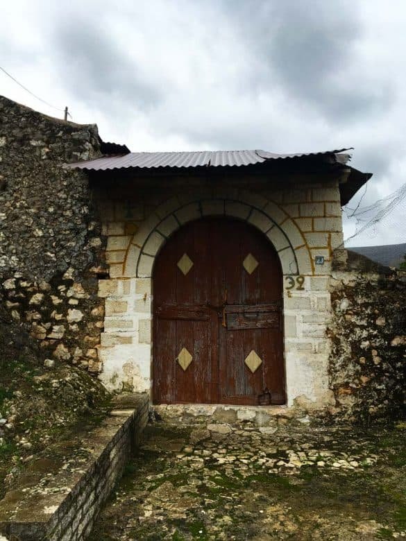Brown Patterned Door – Foiniki, Greece a brown patterned traditional village door at foiniki thesprotia