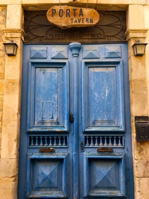 Vintage Blue – Limassol, Cyprus a vintage blue tavern door with brown wall at cyprus