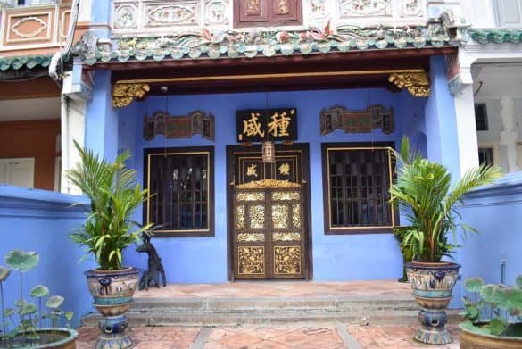 All out blue – Tanjong Pagar, Singapore brown door with asian symbols and blue picturesque wall at singapore