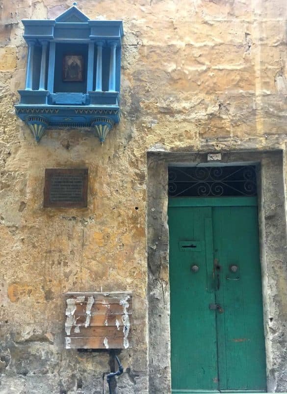 Green vs Blue – Valleta, Malta a green door and a blue window in the old city of valletta