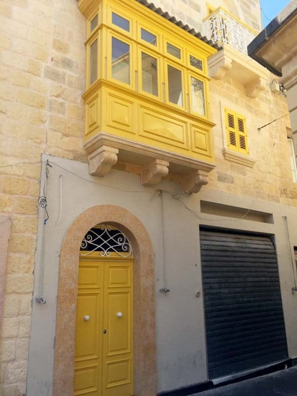 Sunshine – Valletta, Malta a yellow door and a yellow window at the old city of valletta