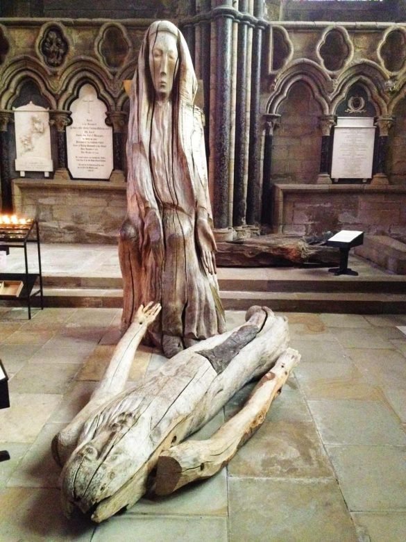 wooden statues of the body of Jesus and Mary