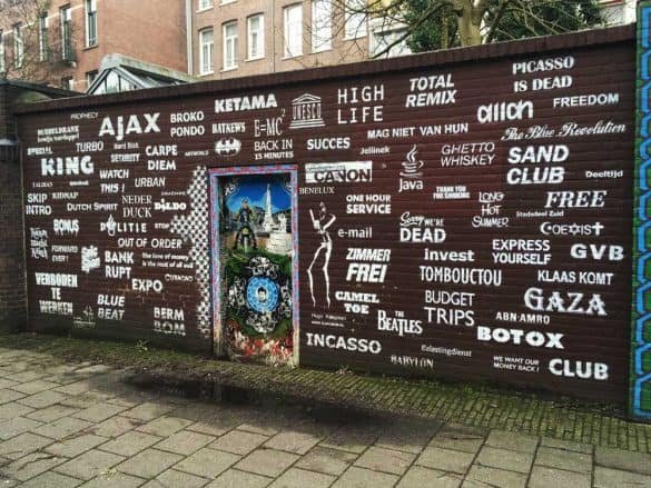 photo of a wall covered in logos in amsterdam