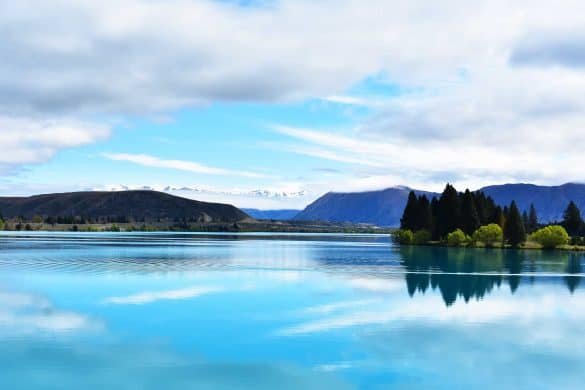 Lake Ruataniwha – Mackenzie, New Zealand Mountains and trees reflections at Lake Ruataniwha - Mackenzie, New Zealand