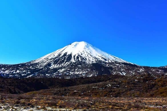 Mount Ngauruhoe – Tongariro National Park, New Zealand Mount Ngauruhoe or mount down with snow on the summit